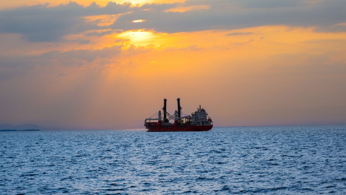 ship sailing ocean sunset